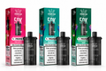 Three Crown Bar PRIME 50K Hypermax pre-filled pods with their colorful retail boxes displayed side by side on a white background. The pods are black with silver accents, and the boxes feature vibrant pink, teal, and dark green designs with flavor labels including Two Apple, Blueberry Lemonade, and Blackcurrant Mint.