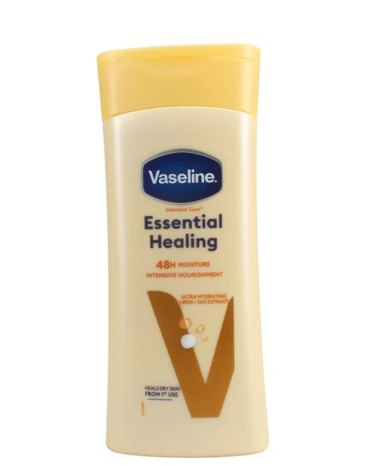 Vaseline Essential Healing lotion bottle with yellow cap and beige packaging, 48h moisture