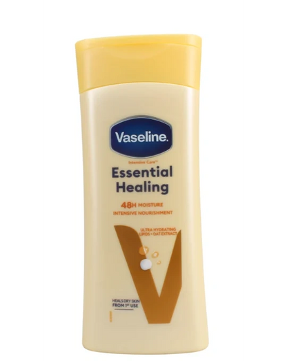 Vaseline Essential Healing lotion bottle with yellow cap and beige packaging, 48h moisture