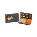 Tuff-Weigh digital pocket scale, orange with rubber grip, in open case beside two packaging boxes
