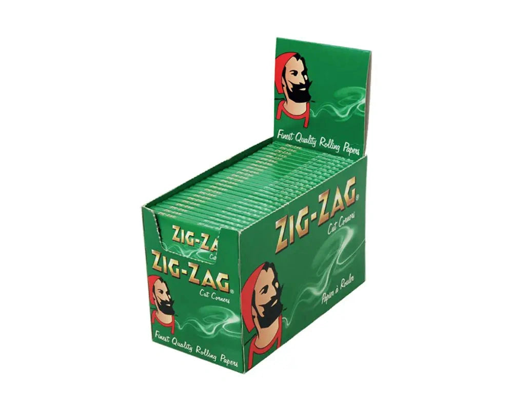 Zig-Zag Standard Green Rolling Papers display box; multiple packs visible, green packaging with Zig-Zag logo